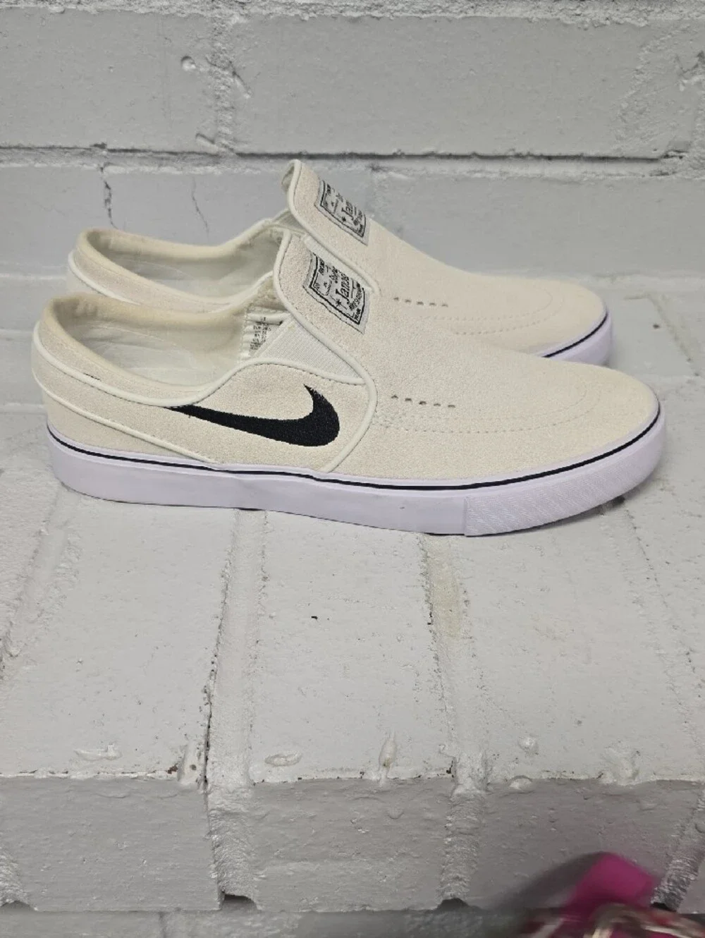 Nike Slip-On Sneakers in Off-White with Black Swoosh